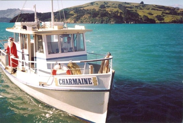 Black Cat Cruise's first vessel in 1985 was the Charmaine, seen here preparing for a Christmas Cruise in 1985. 